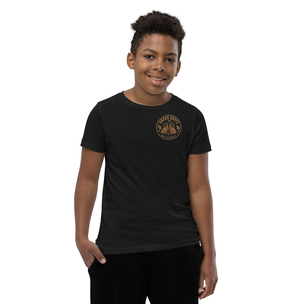 Youth boy wearing a black DREKK™ Legend in Training vintage graphic T-shirt with bold logo design.